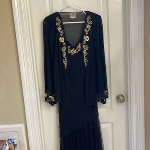 Black evening gown with beige embroidered flowers and jacket.